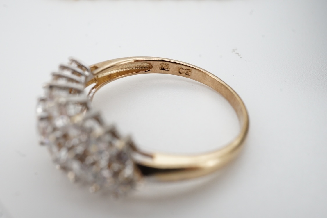 A modern yellow metal (stamped 585) and cubic zirconia set line bracelet, 18cm and a pair of similar drop earrings, together with a similar 9k and cubic zirconia set cluster ring, size N.
